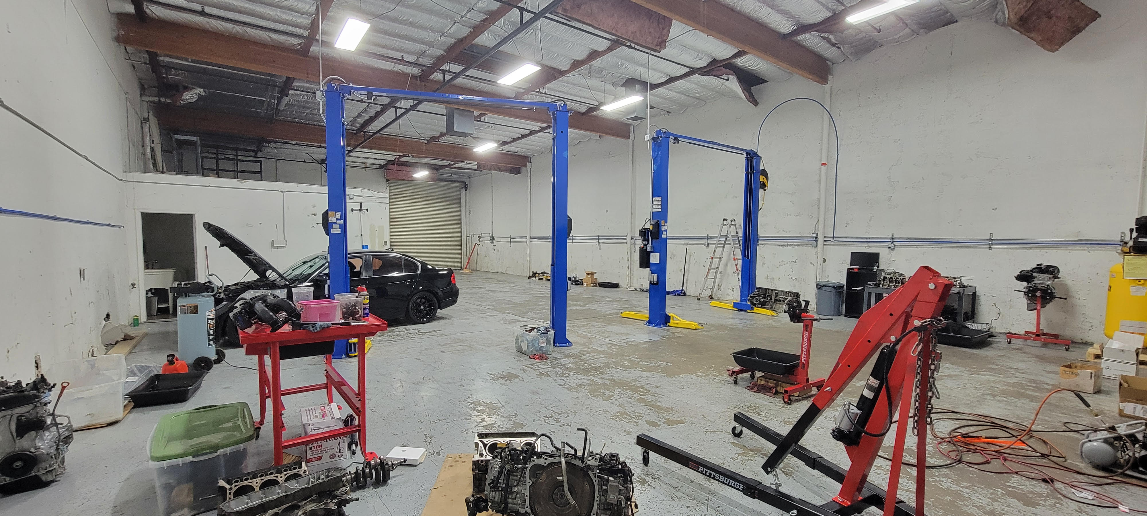 Inside the Norcal Cars Inc auto repair shop bay